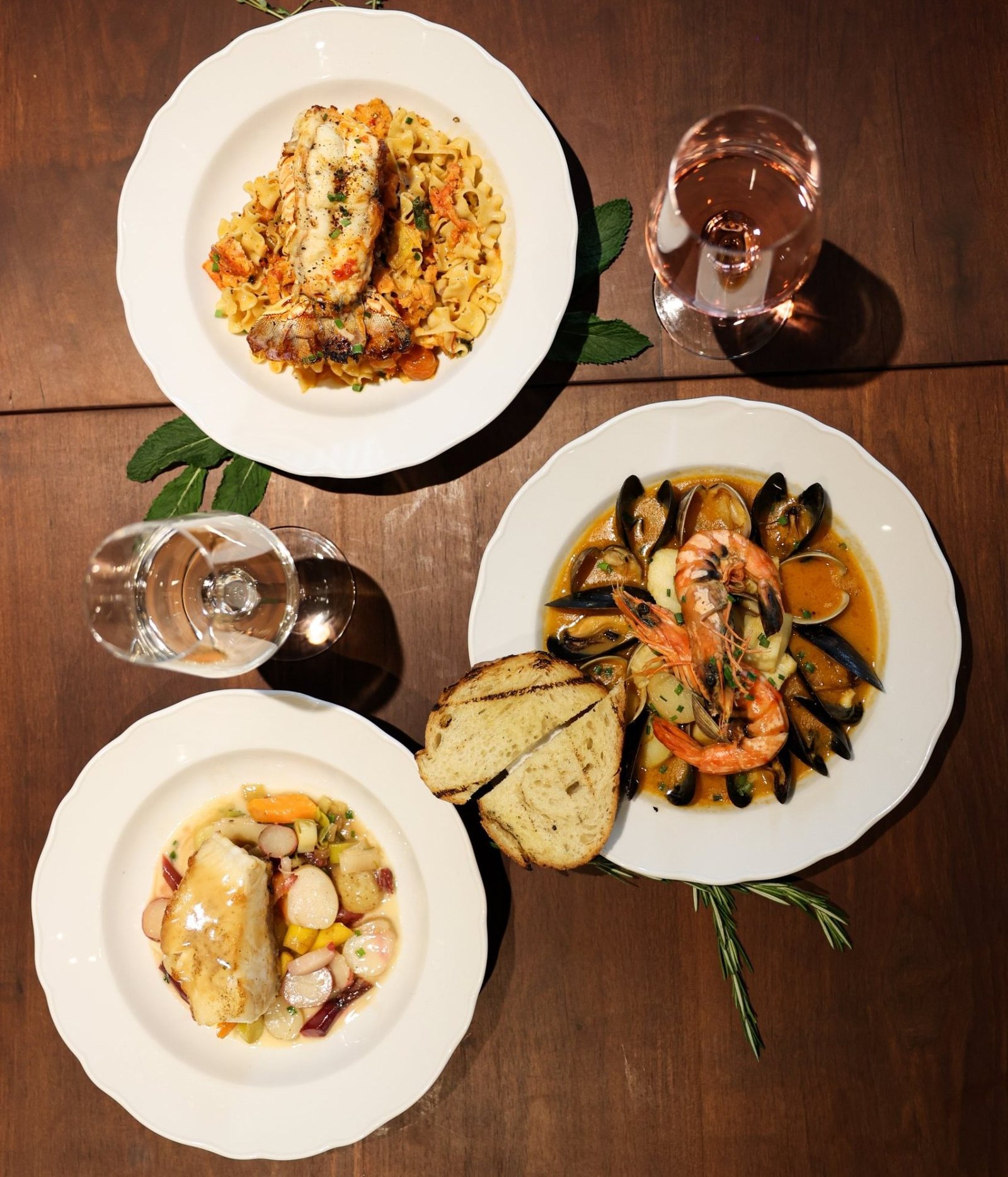 Seafood stew with mussels and prawns, lobster pasta and seared fish at Ce Soir Brasserie + Bar, Oakville